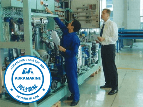 Auramarine Asia 20 years: Testing Engineer Song En Dong and Isto Sakkara carrying out a final inspection of a fuel supply unit in year 2001.